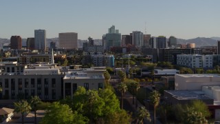 DX0002_138_031 - 5.7K stock footage aerial video of a view of high-rise office buildings in the distance in Downtown Phoenix, Arizona