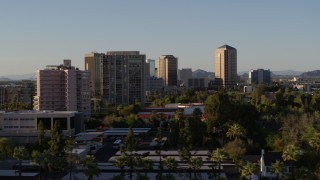 DX0002_138_038 - 5.7K aerial stock footage of passing by high-rise apartment buildings, focus on office buildings in Phoenix, Arizona