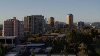 DX0002_138_040 - 5.7K aerial stock footage of high-rise apartment buildings near tall office buildings in Phoenix, Arizona
