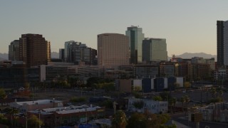 DX0002_138_045 - 5.7K aerial stock footage of a hotel and high-rise office buildings at sunset in Downtown Phoenix, Arizona