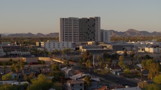 DX0002_138_055 - 5.7K aerial stock footage of a hospital complex at sunset in Phoenix, Arizona