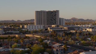 DX0002_138_056 - 5.7K stock footage aerial video of orbiting a hospital complex at sunset in Phoenix, Arizona