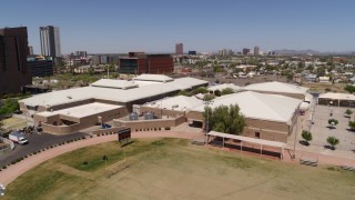 DX0002_140_001 - 5.7K aerial stock footage of orbiting a charter school in Downtown Phoenix, Arizona