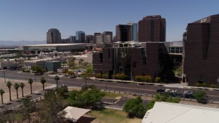 DX0002_140_006 - 5.7K stock footage aerial video flyby city's skyline to reveal college buildings in Downtown Phoenix, Arizona