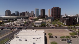 DX0002_140_009 - 5.7K aerial stock footage of approaching city's skyline and a street intersection in Downtown Phoenix, Arizona