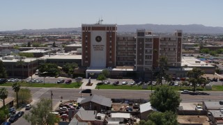 DX0002_140_018 - 5.7K aerial stock footage orbit the Maricopa Medical Center and then fly away, Phoenix, Arizona