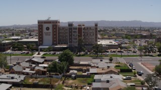 DX0002_140_023 - 5.7K aerial stock footage a reverse view of a hospital complex in Phoenix, Arizona
