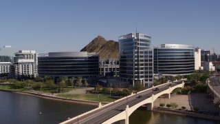 DX0002_142_002 - 5.7K aerial stock footage of a reverse view of modern office buildings in Tempe, Arizona