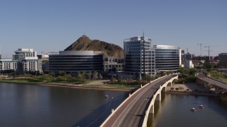DX0002_142_003 - 5.7K aerial stock footage of orbiting modern office buildings in Tempe, Arizona