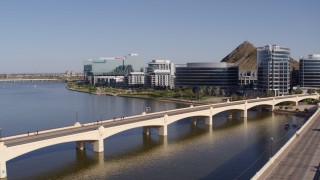DX0002_142_006 - 5.7K aerial stock footage fly away from riverfront condominium complex and office buildings in Tempe, Arizona
