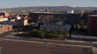 DX0002_142_026 - 5.7K aerial stock footage of orbiting the Maricopa County Sheriff’s Office at sunset in Downtown Phoenix, Arizona