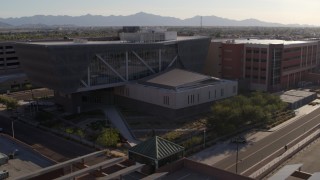 DX0002_142_028 - 5.7K aerial stock footage of the Maricopa County Sheriff’s Office at sunset in Downtown Phoenix, Arizona