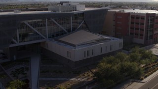 DX0002_142_029 - 5.7K aerial stock footage orbit front of the Maricopa County Sheriff’s Office at sunset in Downtown Phoenix, Arizona