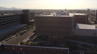 DX0002_142_031 - 5.7K aerial stock footage orbit the side of the Maricopa County Sheriff’s Office at sunset in Downtown Phoenix, Arizona