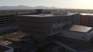 DX0002_142_034 - 5.7K aerial stock footage of an orbit of the Maricopa County Sheriff’s Office building at sunset in Downtown Phoenix, Arizona