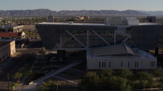 DX0002_142_037 - 5.7K aerial stock footage orbit parking garage and reveal Maricopa County Sheriff’s Office at sunset, Downtown Phoenix, Arizona