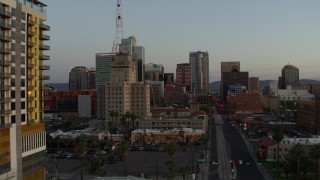 DX0002_143_046 - 5.7K aerial stock footage of Westward Ho building and tall office towers at sunset, Downtown Phoenix, Arizona