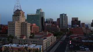 DX0002_143_054 - 5.7K aerial stock footage of towering office buildings, orbit Westward Ho building at twilight, Downtown Phoenix, Arizona