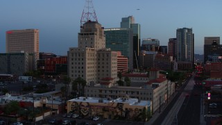 DX0002_143_055 - 5.7K stock footage aerial video orbit Westward Ho building at twilight, Downtown Phoenix, Arizona