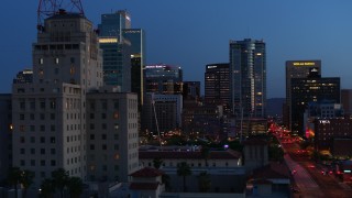 DX0002_143_059 - 5.7K aerial stock footage flyby tall office buildings, and reveal Westward Ho building at twilight, Downtown Phoenix, Arizona