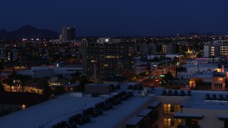 DX0002_143_065 - 5.7K aerial stock footage orbit glass office building at twilight, Downtown Phoenix, Arizona