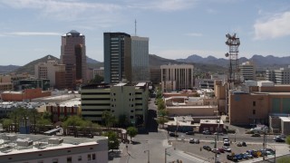 DX0002_144_006 - 5.7K aerial stock footage of orbiting a trio of high-rise office buildings in Downtown Tucson, Arizona