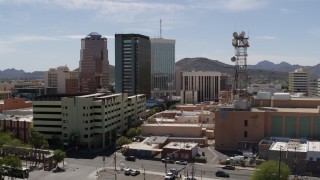 DX0002_144_007 - 5.7K aerial stock footage of orbiting three office high-rises and reveal Sentinel Peak, Downtown Tucson, Arizona