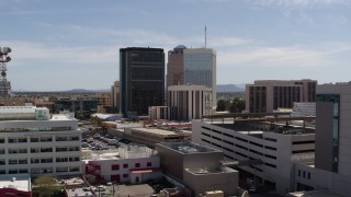 DX0002_144_015 - 5.7K aerial stock footage of orbiting rooftops while focused on office high-rises, Downtown Tucson, Arizona