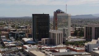 DX0002_144_025 - 5.7K aerial stock footage of tall high-rise office towers seen during descent, Downtown Tucson, Arizona