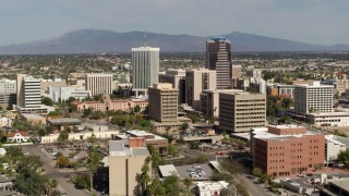 DX0002_144_029 - 5.7K aerial stock footage of flying past tall high-rise office towers, city buildings in Downtown Tucson, Arizona