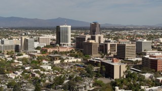 DX0002_144_031 - 5.7K aerial stock footage of tall high-rise office towers and city buildings while ascending in Downtown Tucson, Arizona