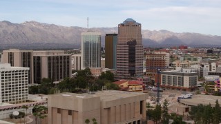 DX0002_145_018 - 5.7K aerial stock footage orbit and fly away from the One South Church office high-rise, Downtown Tucson, Arizona
