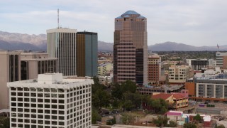 DX0002_145_020 - 5.7K aerial stock footage descend and orbit the One South Church office high-rise, Downtown Tucson, Arizona