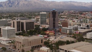 DX0002_145_022 - 5.7K aerial stock footage reverse view of courthouse and office high-rises, Downtown Tucson, Arizona