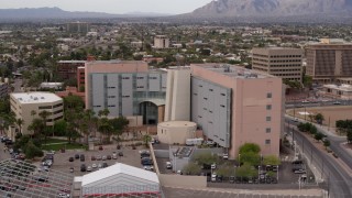 DX0002_145_030 - 5.7K aerial stock footage of a reverse view of a district court building in Downtown Tucson, Arizona