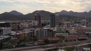 DX0002_145_032 - 5.7K aerial stock footage of orbiting office towers with Sentinel Peak in the background, Downtown Tucson, Arizona