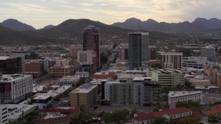DX0002_145_033 - 5.7K aerial stock footage orbit and approach office towers with Sentinel Peak in the background, Downtown Tucson, Arizona