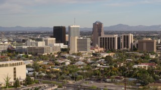 DX0002_146_001 - 5.7K aerial stock footage three office towers while ascending in Downtown Tucson, Arizona