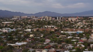 DX0002_146_013 - 5.7K aerial stock footage of university buildings behind residential neighborhood, Tucson, Arizona