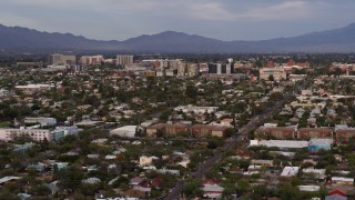 DX0002_146_014 - 5.7K aerial stock footage of university buildings beyond a residential neighborhood, Tucson, Arizona