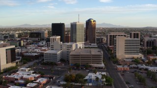 DX0002_146_017 - 5.7K aerial stock footage of orbiting three office towers in Downtown Tucson, Arizona