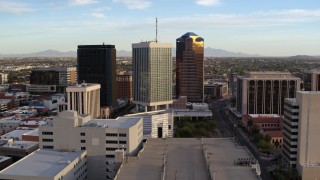 DX0002_146_018 - 5.7K aerial stock footage orbiting around three office towers in Downtown Tucson, Arizona