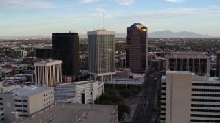 DX0002_146_023 - 5.7K aerial stock footage approach Bank of America Plaza office tower and ascend in Downtown Tucson, Arizona