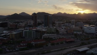 DX0002_146_027 - 5.7K aerial stock footage of three office towers at sunset in Downtown Tucson, Arizona