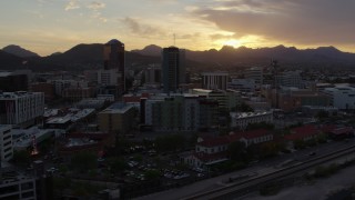 DX0002_146_028 - 5.7K aerial stock footage of passing office towers at sunset in Downtown Tucson, Arizona