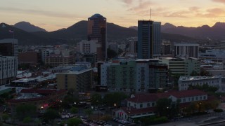 DX0002_147_001 - 5.7K aerial stock footage focusing on high-rise office towers at sunset in Downtown Tucson, Arizona
