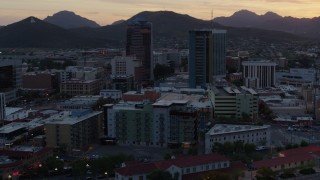 DX0002_147_002 - 5.7K aerial stock footage focus on high-rise office towers at sunset in Downtown Tucson, Arizona
