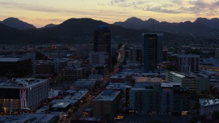 DX0002_147_017 - 5.7K aerial stock footage office towers at sunset, seen while ascending, Downtown Tucson, Arizona