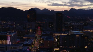 DX0002_147_031 - 5.7K aerial stock footage orbit tall office towers and Congress Street at twilight, Downtown Tucson, Arizona