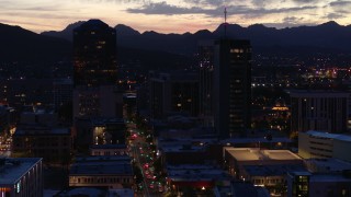 DX0002_147_032 - 5.7K aerial stock footage slow orbit tall office towers and Congress Street at twilight, Downtown Tucson, Arizona